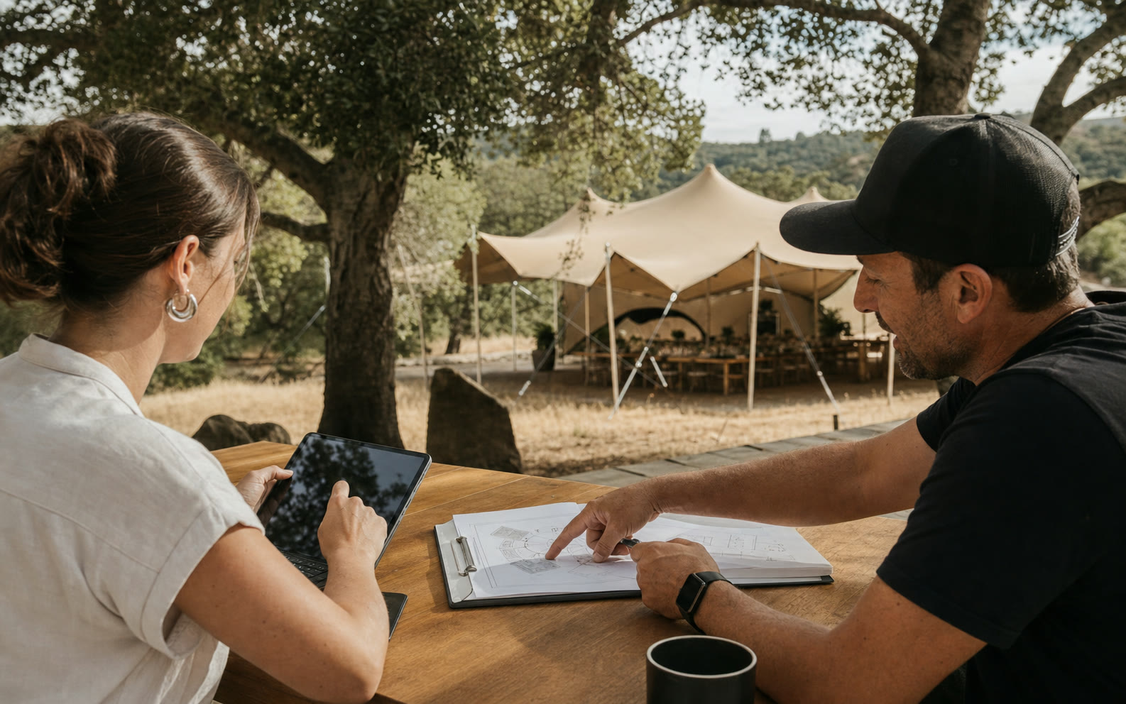 Client and project coordinator confirming a California stretch tent event plan